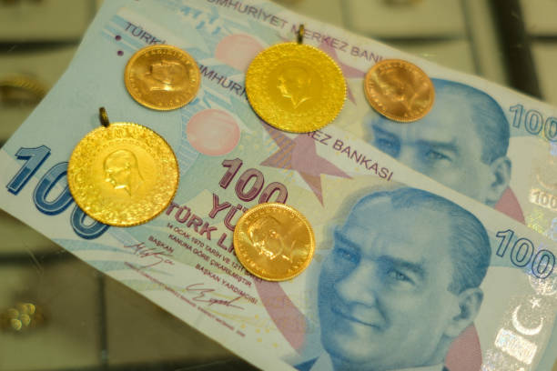 istock Turkish lira and Turkish gold coin 2149233210