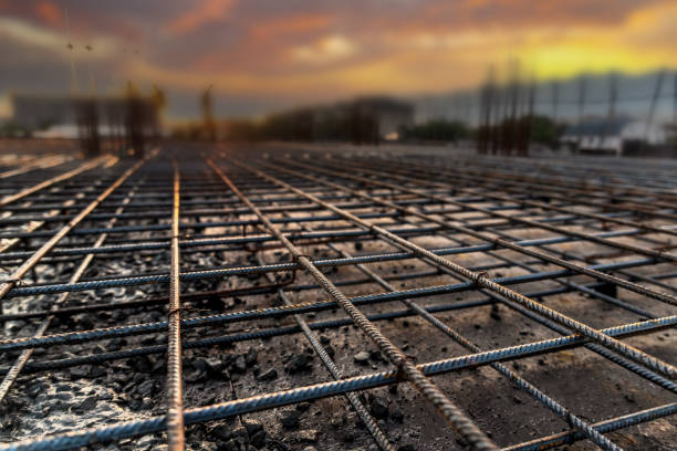 istock Construction site in sunset lighting - Reinforcement frame of the interfloor ceiling and columns of a building under construction 2149233282