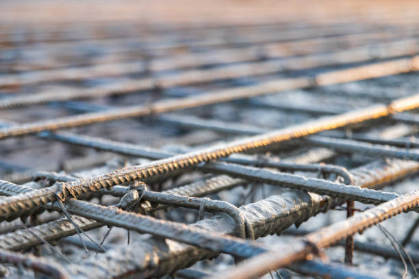 istock Pouring concrete for the reinforcement frame for the interfloor slab. Close-up, shallow depth of field 2149233285