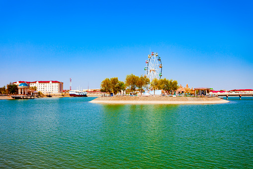 Ferris wheel at the Yoshlar Koli or Youth Lake or Molodezhnoye Ozero at the Amir Timur Park in the centre of Urgench city, Uzbekistan