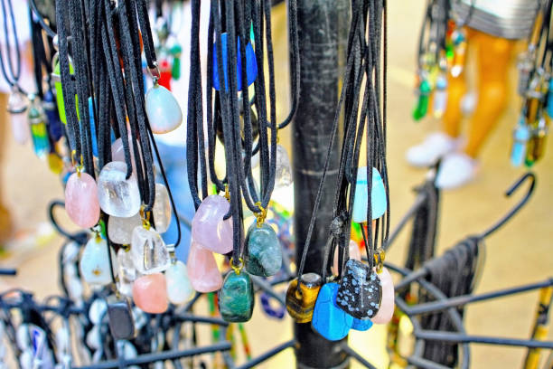Various mineral pendants at a flea market stall.