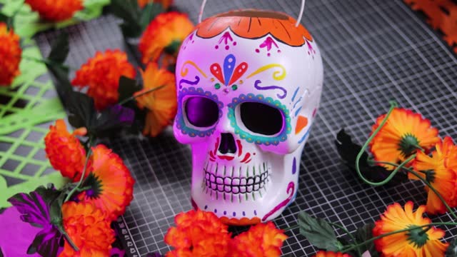 Colorful sugar skull, Day of the Dead traditional decor with flowers