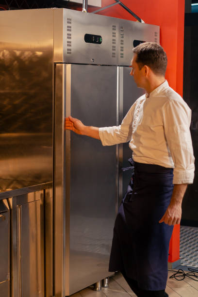 istock professional kitchen chef open the fridge and chooses ingredients for cooking food concept 2149237621