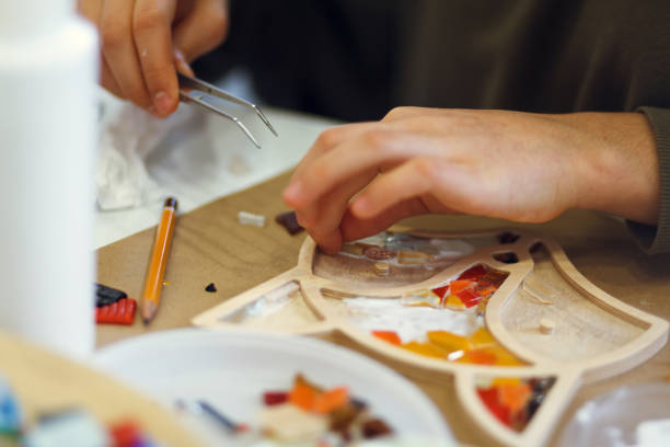 istock The process of creating a mosaic in the shape of a fox. 2149238286