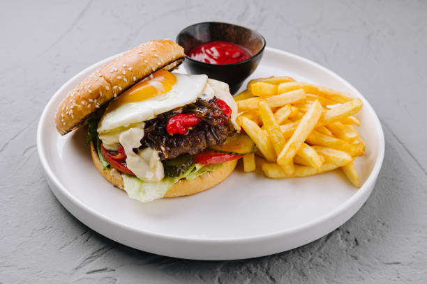 istock Appetizing gourmet burger with fried egg and fries 2149238963