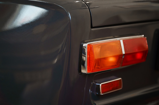 The tail light of a vintage car. Classic car.