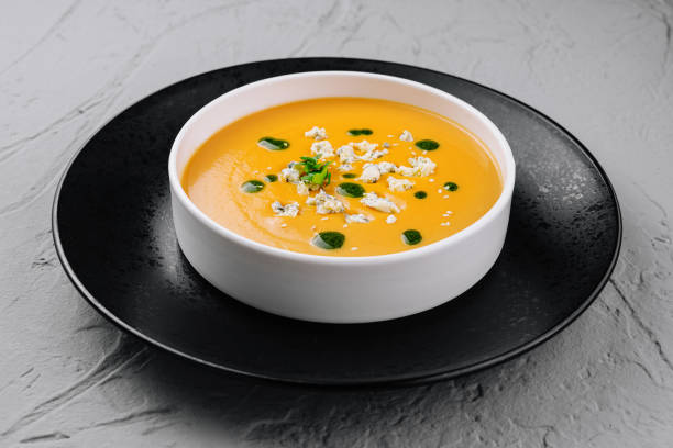 istock Creamy pumpkin soup in elegant white bowl 2149239138