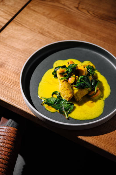 istock Gourmet fish filet with clams and spinach 2149239373