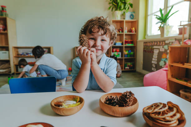 istock Boy playing with natural material in kindergarten or educational daycare centre 2149241025