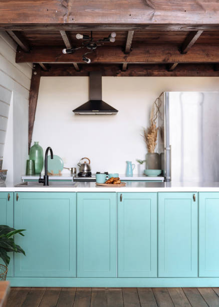 istock Modern cooking island with white countertop and blue facade at small kitchen 2149241762