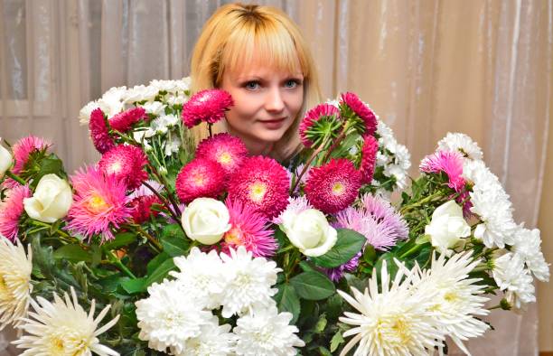 istock Young woman with a beautiful bouquet of flowers. 2149242581