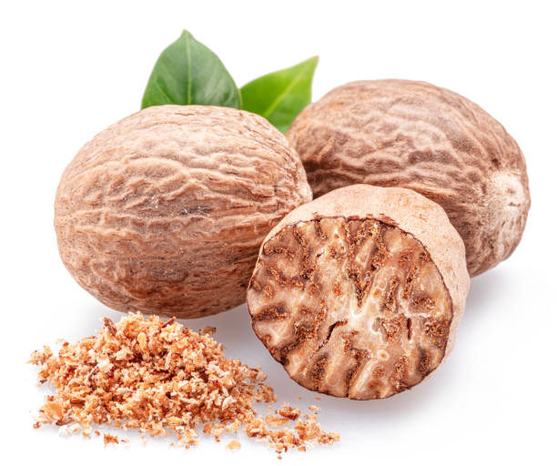 istock Nutmeg and ground nutmeg heap isolated on white background. 2149242677