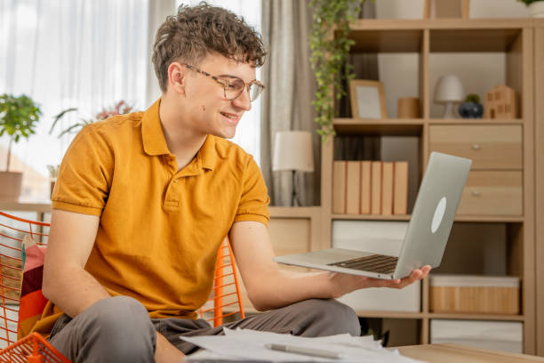 istock One young men working or studying at home, making a video call, video conference 2149242752