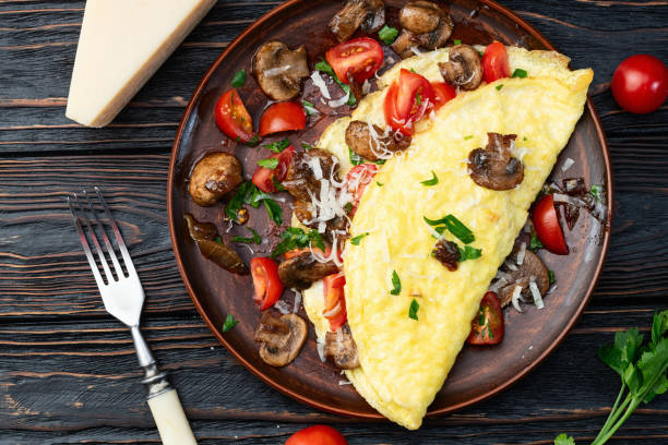 istock Omelette stuffed with mushrooms , tomatoes and parsley 2149243601
