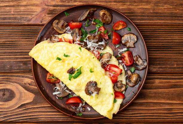 istock Omelette stuffed with mushrooms , tomatoes and parsley 2149243651