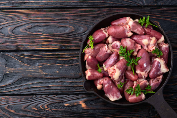 istock Raw chicken giblets hearts , meat background 2149243665