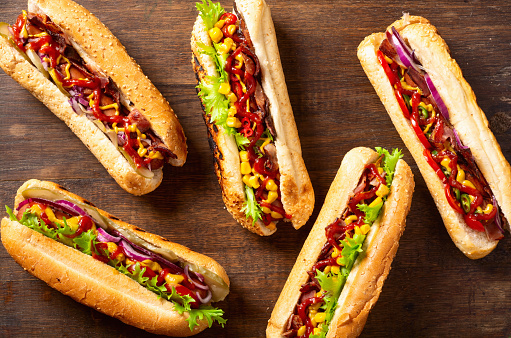Hot dog . Traditional american fast food . Top view on wooden background