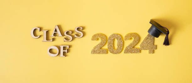 istock Class of 2024 concept. Number 2024 with graduated cap on yellow background 2149245796