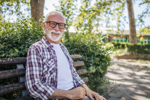 istock Portrait of an elderly man in a public park. 2149245812