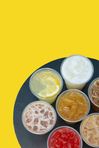 istock Takeaway glasses of summer drinks with ice. Lemonades and coctails on the table 2149246129
