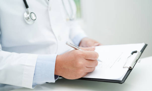 istock Asian man doctor study document to research method and technic for treating patients. 2149246289