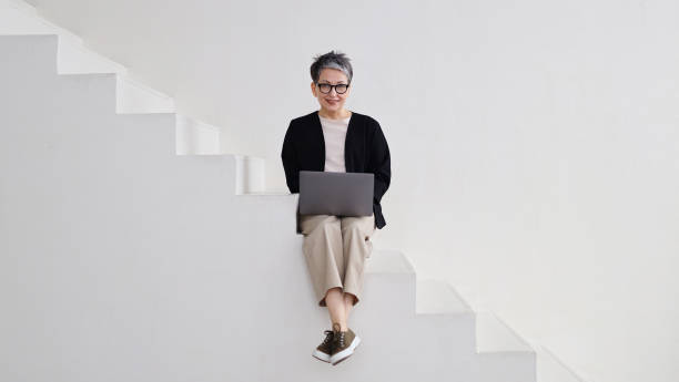 istock A mature businesswoman contemplates while working online, utilizing technology with concentration and professionalism. 2149247551