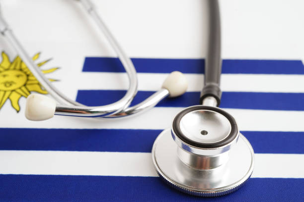 istock Uruguay flag with black stethoscope, Business and finance concept. 2149247664