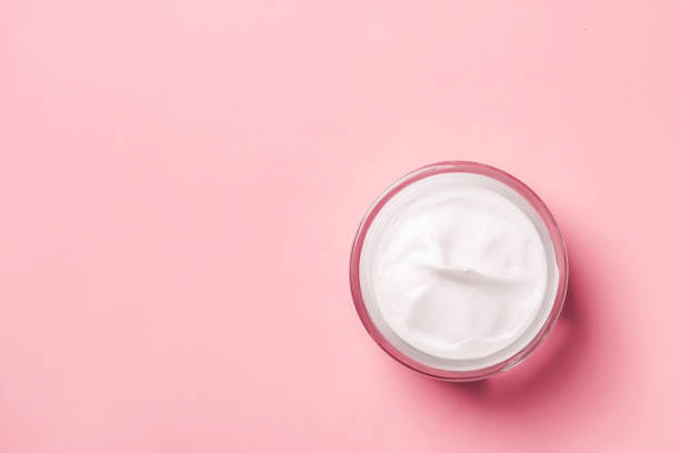 istock Cream jar of white  on a pink background. 2149248459