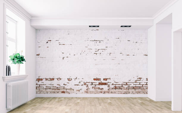 Empty retro style white room with ruined white brick wall background, moldings and windows on a side