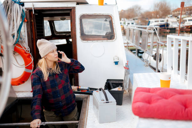 istock A Woman on a Call While Handling Boat Repairs 2149248589