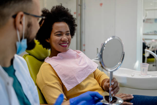 istock Smiling patient in dental care session 2149251539