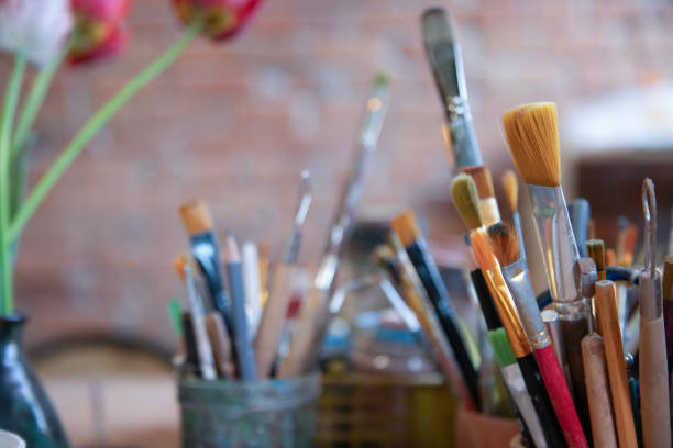 istock Art and craft tools close up view .   Colorful array of paintbrushes and paints 2149252056