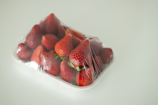 packaged red and ripe strawberries