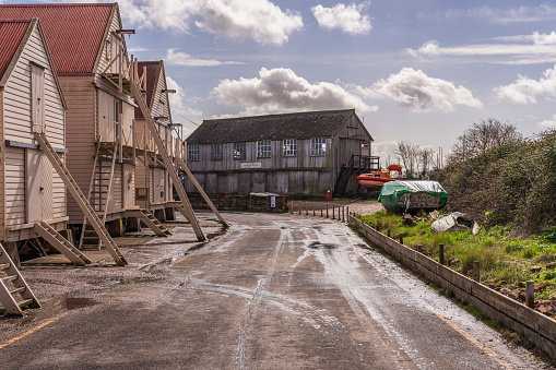 Tollesbury, Essex, England, UK - March 24, 2023: Wooden houses near the harbour