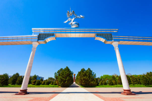 Tashkent, Uzbekistan - April 11, 2021: Storks flying over the globe in the Ezgulik Arch of Good and Noble Aspirations at Independence square, Tashkent city in Uzbekistan