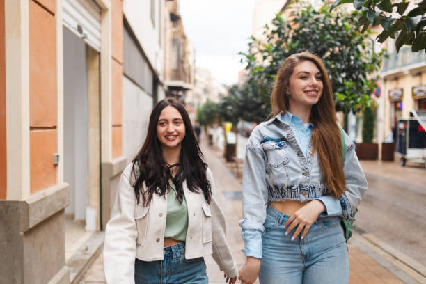 istock Two smiling young women walking through Malaga city in Spain 2149259230