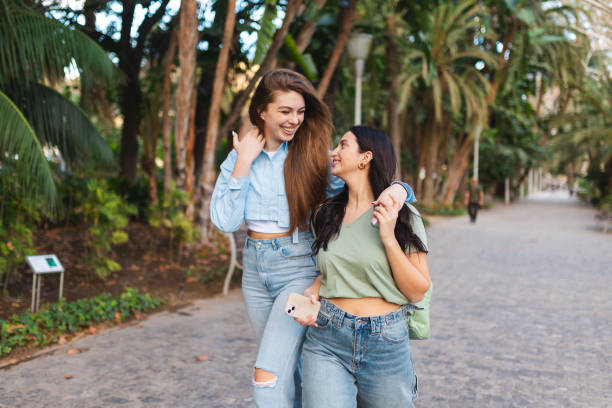 istock Two beautiful friends taking a walk together 2149261178