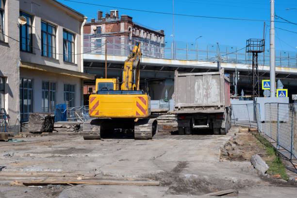istock Yellow excavator and dump truck resting on a construction site 2149261579