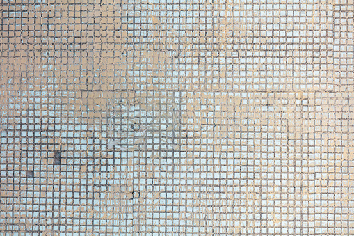 Small tiles on the wall as an abstract background. Texture.