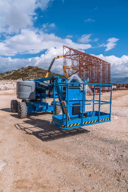 istock Lifting crane tractor on industrial construction site. Heavy duty machinery for building industry 2149264293