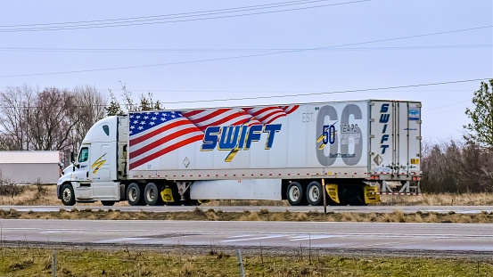 February 2019\nSpokane, Washington USA \nSwift Transport semi-truck pulling a trailer celebrating the trucking company's 50th anniversary.\nIn 2017, the Phoenix, Arizona based company merged with Knight Transportation, also of Phoenix.