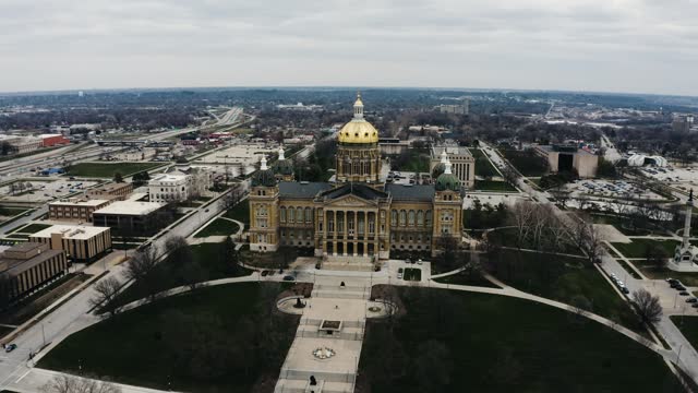Wide drone shot of the Iowa State Capitol on a cloudy day.