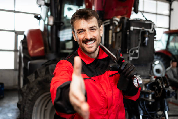 istock Tractor service and maintenance employment. 2149268511