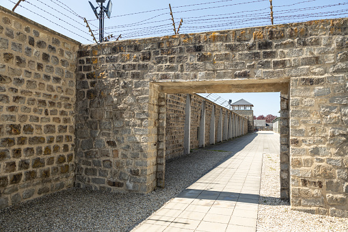 Mauthausen, Austria - Mai 9, 2023: concentration camp buildings fenced off with barbed wire