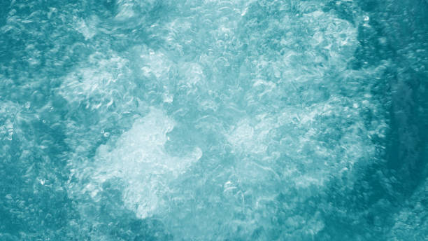 istock Bubbling water texture, flow thermal water as abstract banner background macro photo, spa and wellness theme, gentle ripples on white turquoise aquatic surface, sea monochrome gradient 2149273706