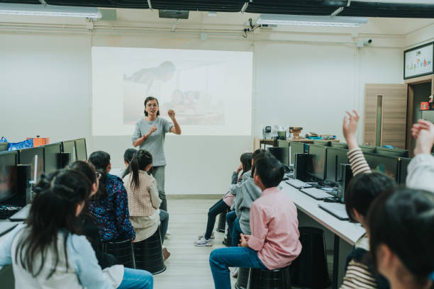 istock A teacher conducting Photography Workshop for primary school students. 2149274764