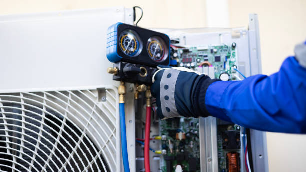 istock Close-up Air conditioner technician hand check  fill refrigerant liquid and maintenance condenser unit, Home care service 2149275717