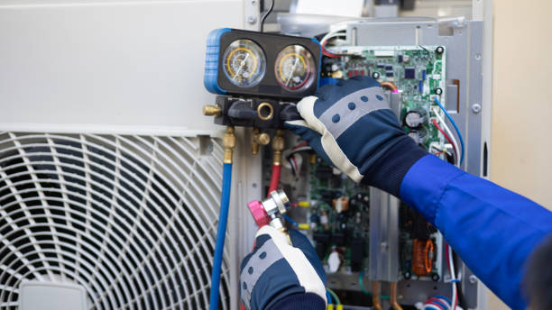 istock Close-up Air conditioner technician hand check  fill refrigerant liquid and maintenance condenser unit, Home care service 2149275743