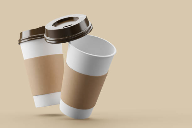 istock Paper coffee cup with black lid on sorft pink background mockup 3d rendering 2149275834
