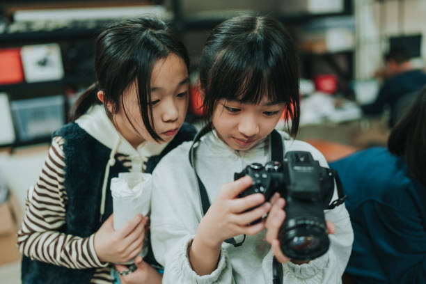 istock Two girls are looking at a camera. 2149276196